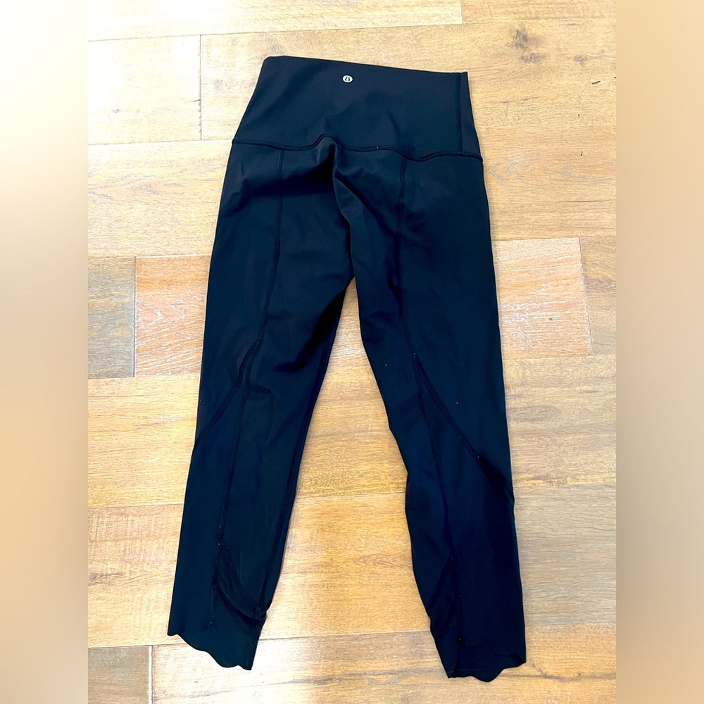 Lululemon size 8 black cropped leggings with scalloped/mesh ankle detail